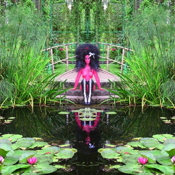 A photo of artist and rocker Kebra Pfahler in Monet&#039;s Giverny Garden, part of a new exhibit at The Hole.
