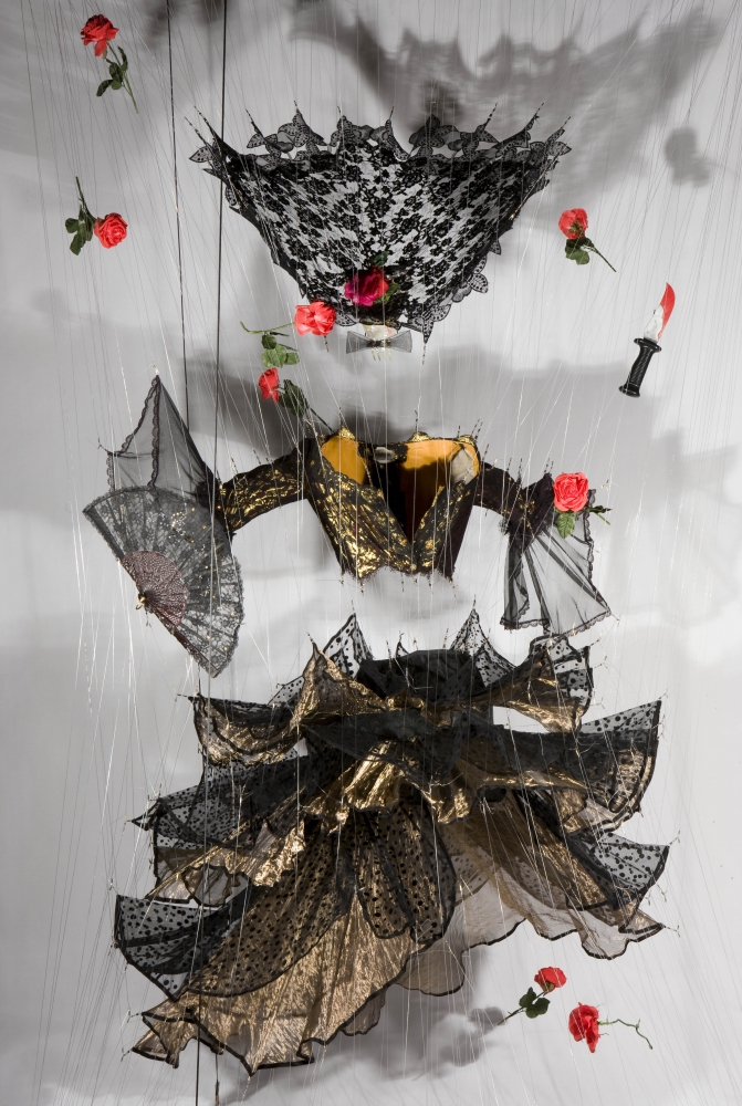 Carmen, (2009). Carmen costume from NYC Opera, plastic flowers and daggers, fishline and hardware.